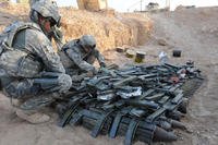 1st Sgt. John R. Cruz supervises the placement of explosives at an ordnance disposal range outside Camp Ramadi, Iraq, Sept. 24. (Photo: Staff Sgt. Nancy Lugo)