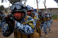 Iraqi Federal Policeman practice firing during a training session led by 3rd Federal Police Division Transition Team Soldiers on firing techniques and positions on FOB Marez. (Army Photo/Pfc. Crystal M. O'Neal)