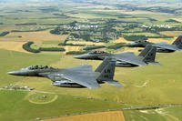 A trio of F-15E Strike Eagles from the 492nd Fighter Squadron at Royal Air Force Lakenheath, England, flies past Stonehenge.