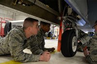 Airmen with the 372nd Training Squadron Detachment 21, inspect the landing gear of a RQ-4 Global Hawk Jan. 20, 2015, at Beale Air Force Base, Calif. (U.S. Air Force photo by Senior Airman Bobby Cummings)