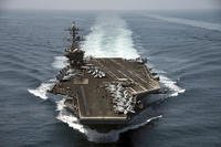 The aircraft carrier USS Theodore Roosevelt (CVN 71) operates in the Arabian Sea conducting maritime security operations.