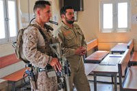 Marine Corps 1st Lt. Manuel Ruiz monitors a heating, ventilation, and air conditioning class conducted by Afghan army engineers at Camp Hero, Afghanistan, May 3, 2014. (U.S. Army photo)