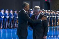 President Barack Obama, left, embraces Secretary of Defense Chuck Hagel during a celebration in honor of Hagel's service, on Wednesday, Jan. 28, 2015, in Fort Myer, Va. Obama. (AP Photo/Evan Vucci)