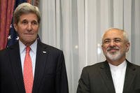 U.S. Secretary of State John Kerry and Iran's Foreign Minister Mohammad Javad Zarif, right, pose before resuming talks over Iran's nuclear program in Lausanne, Switzerland on March 16, 2015. Brian Snyder/AP