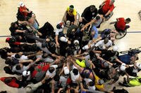Army trials team tryouts and coaches for the 2015 Department of Defense Warrior Games huddle before basketball practice on Fort Bliss in El Paso, Texas, March 28, 2015.(U.S. Army photo/EJ Hersom)