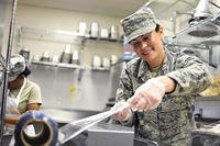 Illinois Air National Guard Airman 1st Class Tanya L. Brown, a services journeyman with the 182nd Force Support Squadron, wraps food after lunch in Peoria, Ill., May 2, 2015. (Illinois Air National Guard/Staff Sgt. Lealan Buehrer)