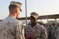 U.S. Navy Petty Officer 2nd Class Ambrose McGill, a hospital corpsman with Special Purpose Marine Air Ground Task Force—Crisis Response—Central Command, is presented his Fleet Marine Force pin. (U.S. Marine Corps/Sgt. Owen Kimbrel)