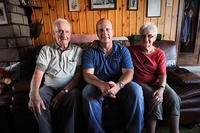From left, Gaston Mean, an Awyaille, Belgium, resident for more than 70 years, sits with U.S. Air Force Chief Master Sgt. James McCloskey, and Mean's wife, in the living room of the Mean family. (U.S. Air National Guard Senior Airman Shane Karp)