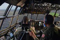 The crew of an HC-130 Hercules airplane sights the 45-foot sailing vessel Second Chance as the sun rises and makes radio contact with the six people aboard. (Photo: Chief Petty Officer Sara Mooers)