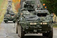 Elements of U.S. Army Europe's 2nd Stryker Cavalry Regiment enter the village Schalkenthan, near Grafenwoehr, Germany, on Oct. 15, 2012. Markus Rauchenberger/Army photo
