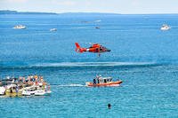 Crew from Coast Guard Air Station Traverse City, Mich., conduct hoist training with a 25-foot response boat in Lake Michigan, July 4, 2014. (U.S. Coast Guard photo courtesy of Air Station Traverse City)
