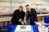 Capt. Monte L. Ulmer, Samuel J. Cox and Councilman Charles Allen cut a cake during the closing ceremony for the Display Ship Barry. (U.S. Navy/MC2 Tyrell K. Morris)