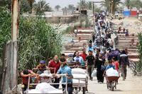 http://www.In this 2015 photo, Iraqi families fleeing violence in Ramadi walk across Bzebiz Bridge into Baghdad province. (Photo by Wathiq Khuzaie/UNICEF).com/army