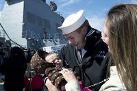 Construction Mechanic 2nd Class Jeff Reyes, assigned to the guided-missile destroyer USS Winston S. Churchill (DDG 81), meets his baby for the first time as the ship arrives in Norfolk in 2013. Mass Communication Specialist 3rd Class Sabrina Fine/Navy