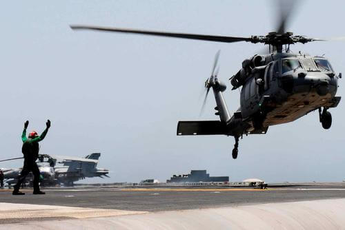 An MH-60S Seahawk helicopter lifts off