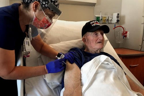 Veteran receives COVID-19 vaccine at the Veterans Affairs agency in Phoenix.
