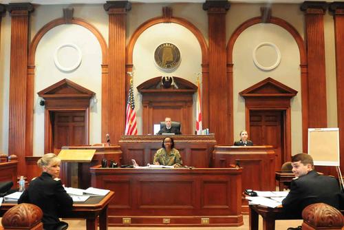 Members of the Judge Advocate General Corps complete a mock court martial