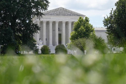 U.S Supreme Court is viewed from the lawn of the U.S. Capitol
