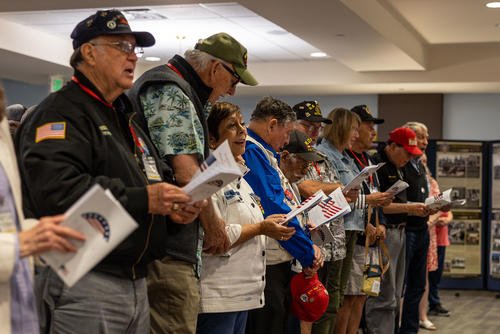 Vietnam veterans sing during a Vietnam Veterans Day celebration at the Veterans Association of North County, Oceanside