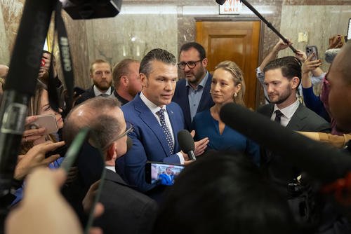 Pete Hegseth, president-elect Donald Trump's choice to be defense secretary, is joined by his wife, Jennifer Rauchet, as he speaks with reporters after meeting with Sen. Susan Collins, R-Maine, on Capitol Hill.