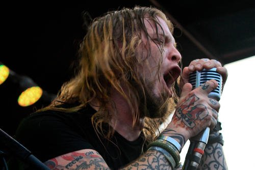 Drowning Pool vocalist Ryan McCombs sings into his signature microphone during a free concert on Joint Base Lewis-McChord, Washington.