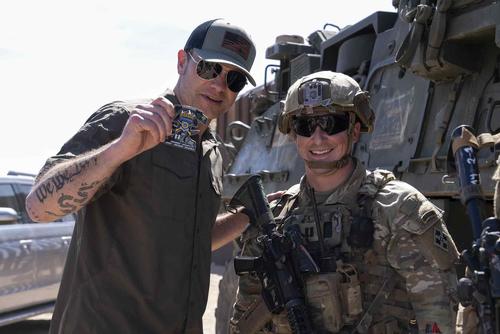 Secretary of Defense Pete Hegseth receives a coin