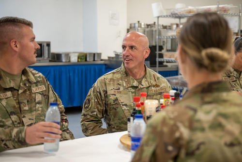 Chief Master Sergeant of the Air Force David Flosi speaks with airmen assigned to the 380th Air Expeditionary Wing during a visit at an undisclosed location within the U.S. Central Command area of responsibility.