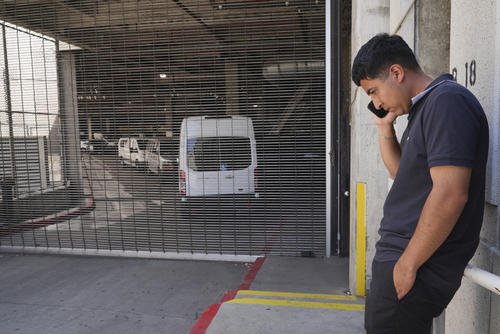 Alejandro Barranco talks on his cell phone