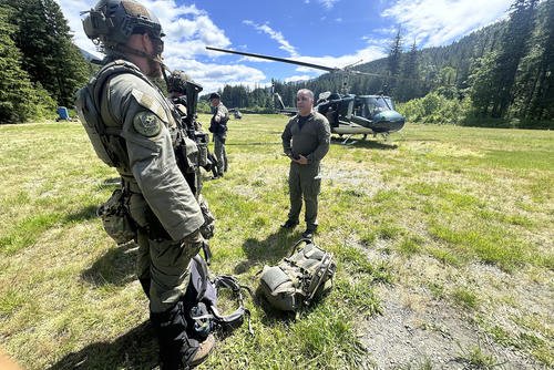 In this handout photo provided by the Snohomish County Sheriff's Office, deputies participate in the search for Travis Decker at an undisclosed location in Washington state, Friday, June 6, 2025.
