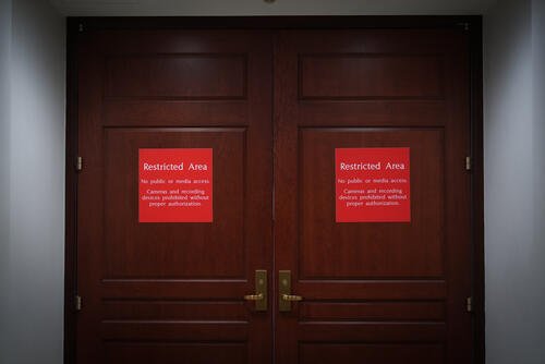 The closed entrance to a secure room is seen where Navy Adm. Frank &quot;Mitch&quot; Bradley, commander of the U.S. Special Operations Command, is expected to brief top congressional lawmakers overseeing national security as they investigate how Defense Secretary Pete Hegseth handled a military strike on a suspected drug smuggling boat and its crew in the Caribbean near Venezuela Sept. 2, at the Capitol in Washington, Thursday, Dec. 4, 2025. (AP Photo/J. Scott Applewhite)